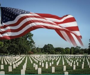 American flag over a cemetery